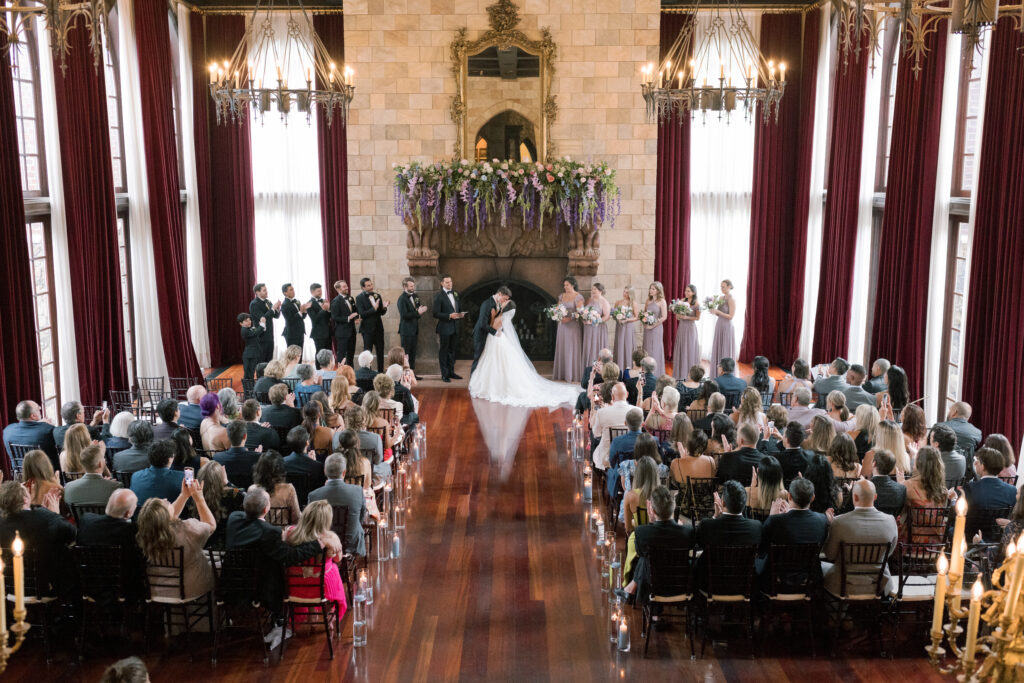 A bride and groom share a first kiss in Dover Hall, an English mansion in Virginia. 